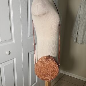 Round Rattan Crossbody Purse. Blue/pink Floral Lined. Excellant Condition.